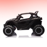 Black toy off-road vehicle on a gradient pink to white background