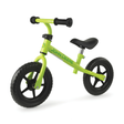 Green balance bike with black handlebars and wheels on a white background