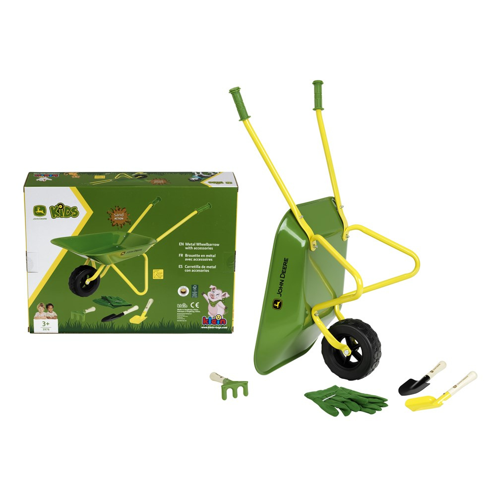 John Deere kids' toy wheelbarrow set with a green and yellow plastic wheelbarrow, matching box packaging, green gardening gloves, a green hand fork, and small yellow-and-white trowels on a white background.