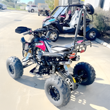 ATV with large wheels and off-road tires on a paved surface