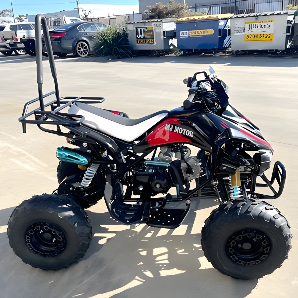 ATV with 'MJ Motor' branding on a paved surface with vehicles and trailers in the background.