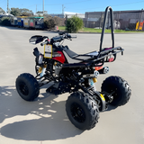ATV (All-Terrain Vehicle) on a concrete surface with a clear sky background