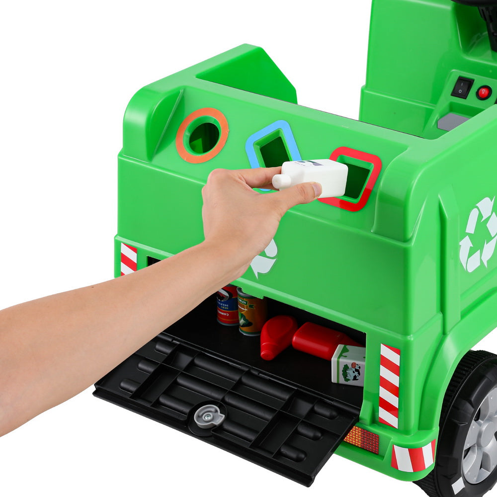 Close-up of the toy truck’s steering wheel with detailed controls and colourful buttons.