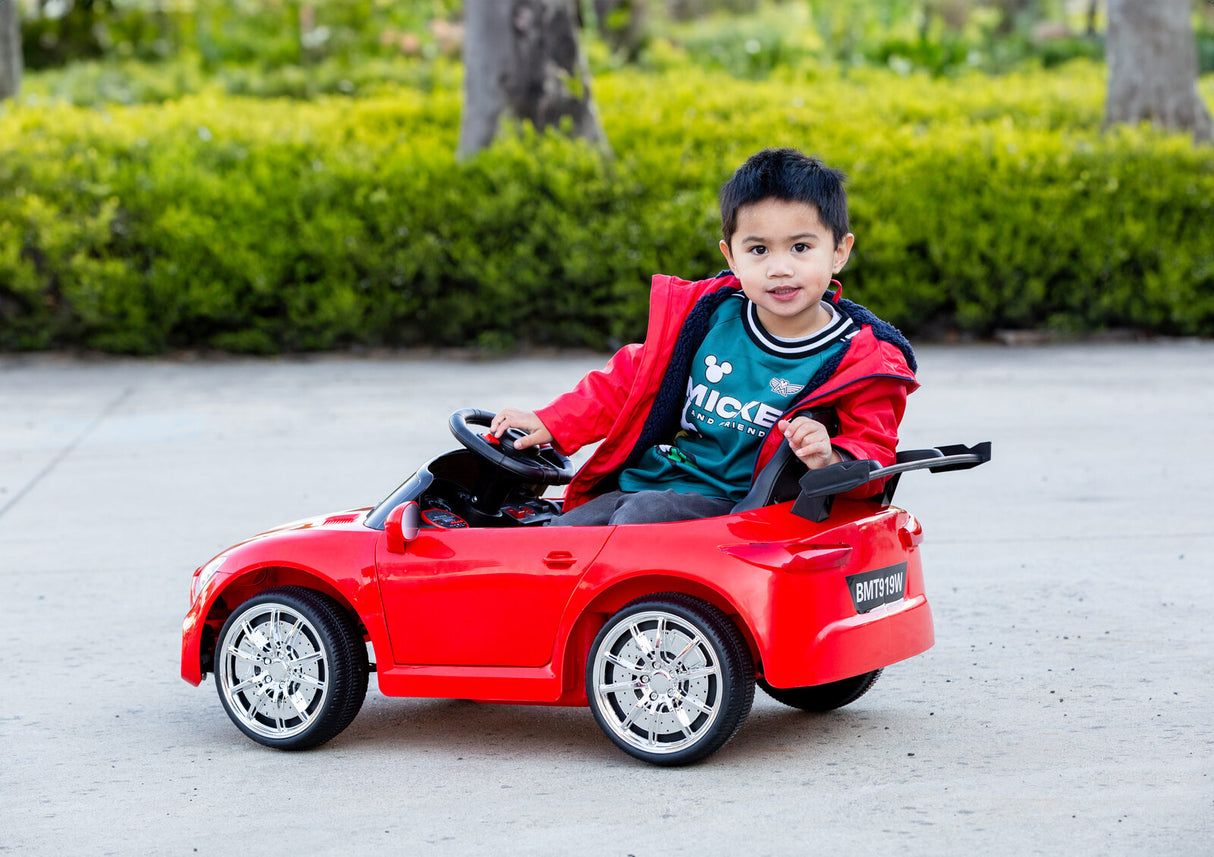 Side view of the ride-on car showcasing its compact and sporty design.