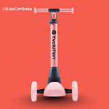 A pink Yvolution Glider Nua 3-wheel kids scooter shown against a solid red background.