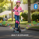 Child riding a scooter with music notes and Bluetooth icon, indicating built-in speaker feature.
