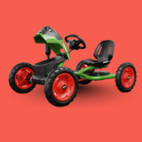 Toy pedal car with green body and red wheels on a red background
