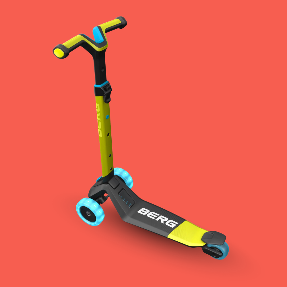 Yellow and black scooter with blue wheels on a red background