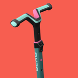 Teal scooter handlebar with pink accents on a red background