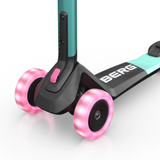 Children's scooter with pink wheels and visible 'BERG' branding on a white background