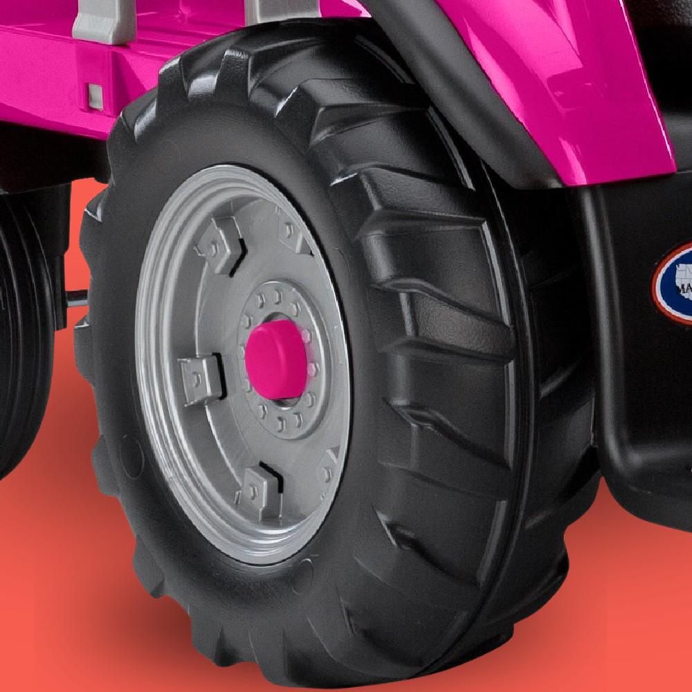 Close-up of a pink toy vehicle tire with a red background