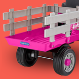 Pink toy wagon with gray bed on an orange background