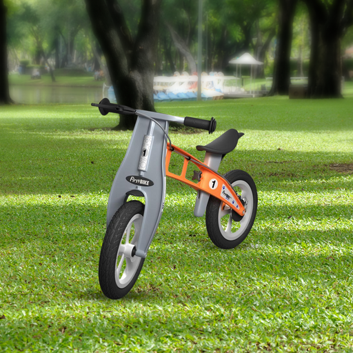 park view with the FirstBIKE Lightweight Street Balance Bike with Brake - Orange