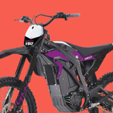 An electric dirt bike with a black and purple frame, a white front number plate, and a black seat, shown against a solid orange-red background. The brand 'DECUT' is visible on the side panel.