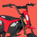 Red and black electric mini dirt bike with custom flame decals and 'Go Skitzz' branding, shown against a solid red background.
