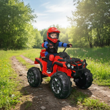 Child riding a red toy ATV in a forest setting