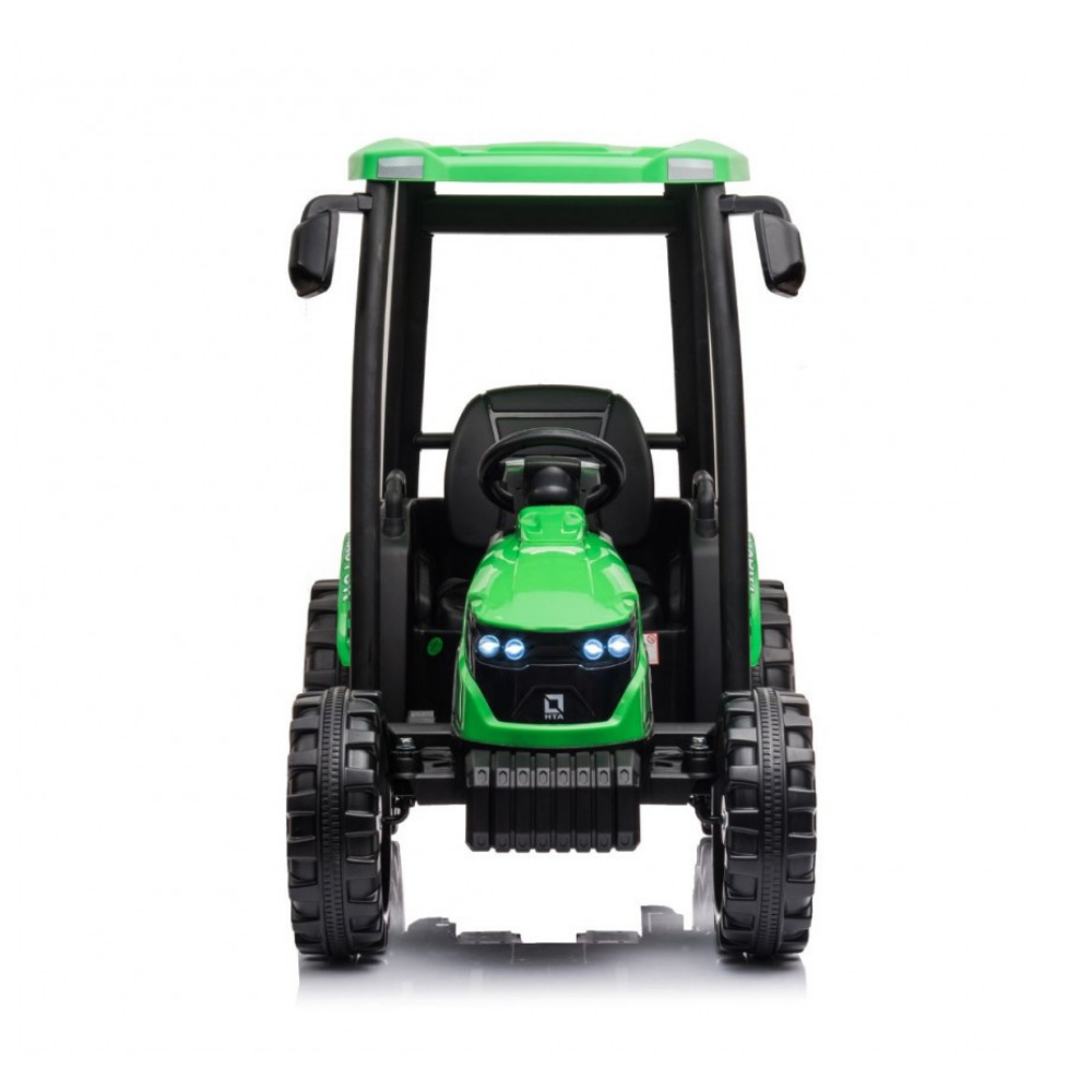A green and black ride-on toy tractor with a cab, large black wheels, and illuminated LED headlights, shown from a front-facing perspective on a white background.