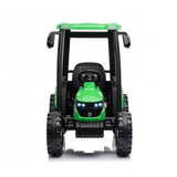 A green and black ride-on toy tractor with a cab, large black wheels, and illuminated LED headlights, shown from a front-facing perspective on a white background.