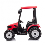 A red and black ride-on toy tractor with a small driver seat, steering wheel, and large black tires, shown from the side on a white background.