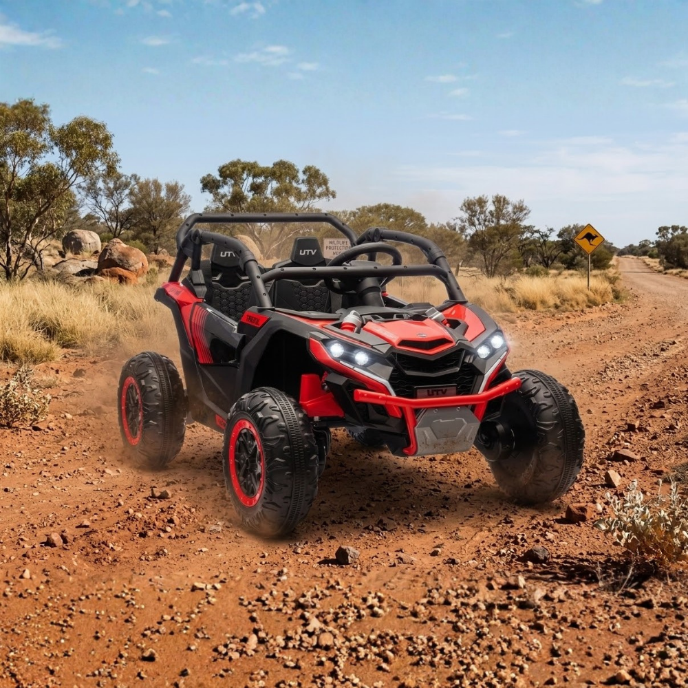 Go Skitz Switch 24V E-Buggy Kids Ride On on a dirt track with a clear sky and trees in the background