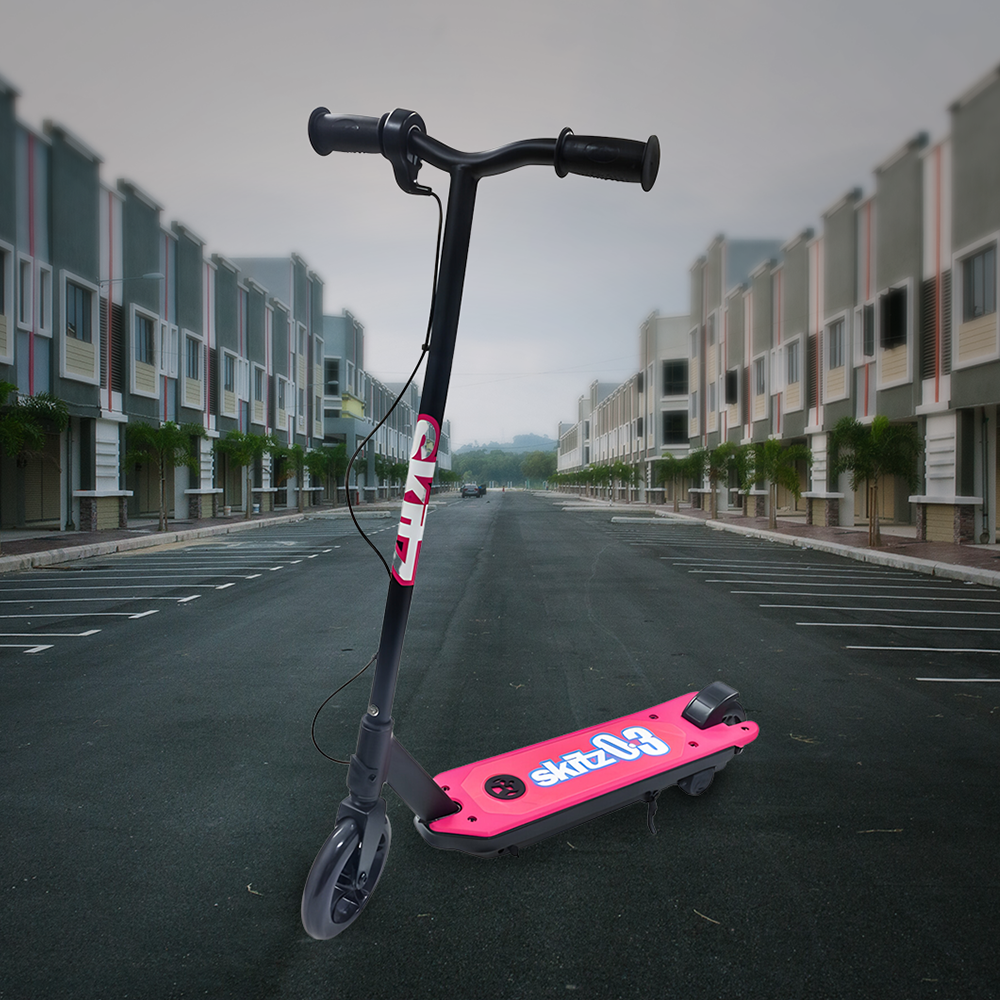 Lifestyle Image in Urban Setting: The scooter is shown outdoors on an empty street surrounded by modern buildings, emphasizing its suitability for urban environments.