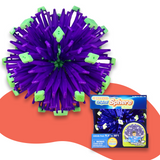 Purple and green Hoberman Sphere in a contracted state, with packaging displayed at the bottom right corner, set against a red and white background