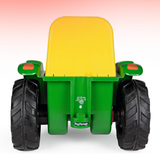 Toy tractor with a yellow bed and green body on a white background