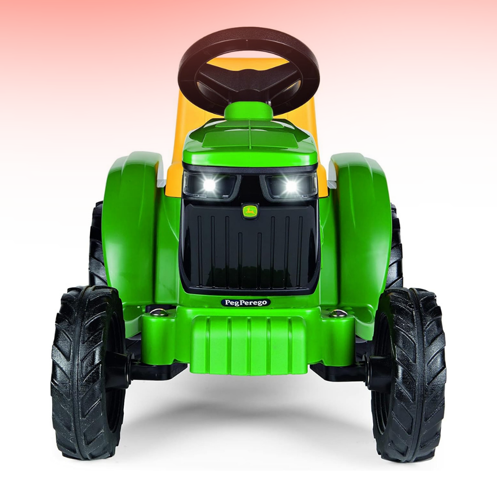 Green toy tractor with black tires on a white background