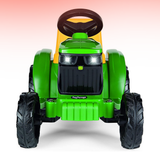 Green toy tractor with black tires on a white background
