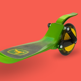 Green scooter with a logo on a red background