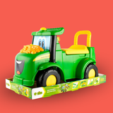 Toy tractor with a smiling face on a red background