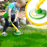 A young child outdoors using a small yellow and green lawn mower on grass, with a circular inset showing a close-up of the mower attachment.