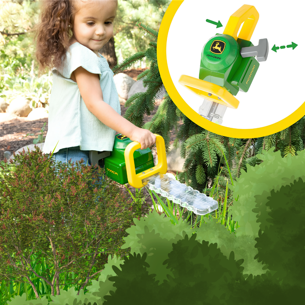 A young girl outdoors using a green and yellow John Deere toy hedge trimmer on grass and bushes, with a circular inset showing a close-up of the toy hedge trimmer.