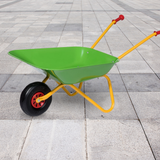 Colorful children's wheelbarrow on a tiled floor
