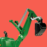 Toy excavator on a red background