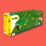 John Deere Kids toy garden tool set in its original green and yellow retail packaging, featuring a wheelbarrow, rake, and shovel with cartoon animal illustrations on a solid coral background.