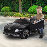 kid beside the electric ride on car