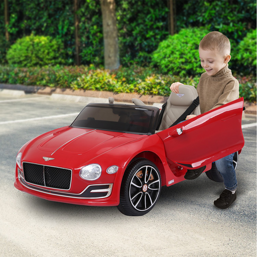 kid riding a red bentley ride on car 