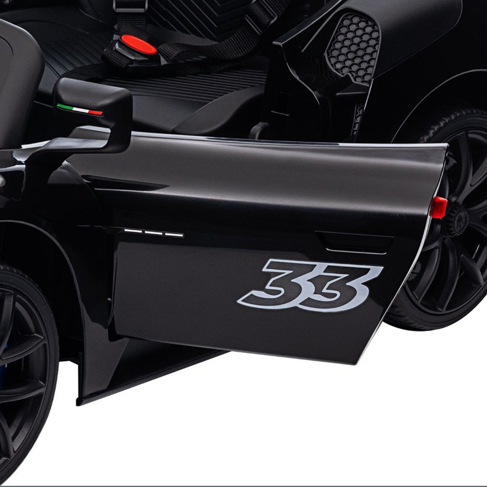 Close-up of a glossy black vehicle door with a large silver '33' graphic, shown against a white background.