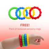 Colourful textured sensory rings with a hand wearing them on a gradient background