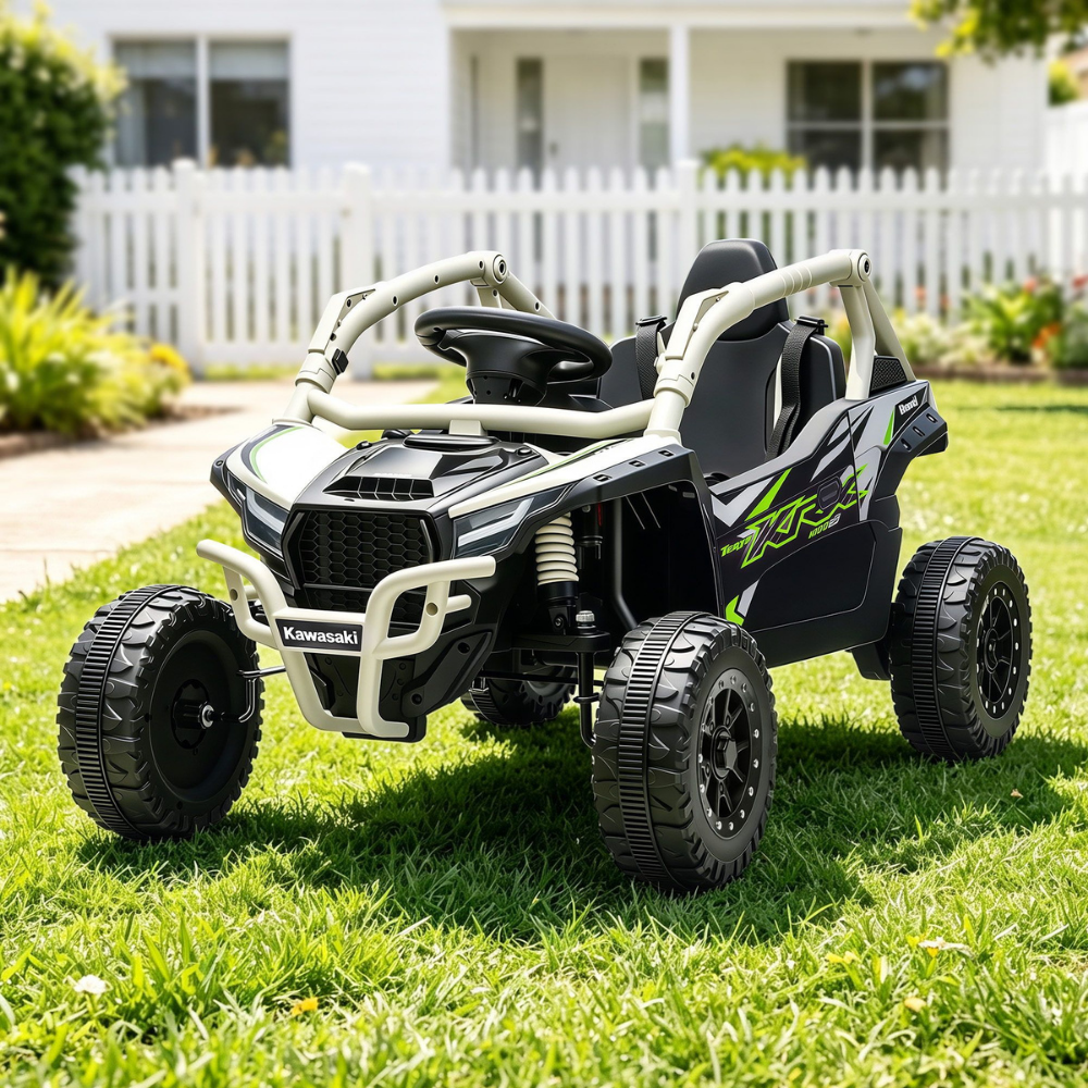 Children's toy off-road vehicle on grass with a house in the background