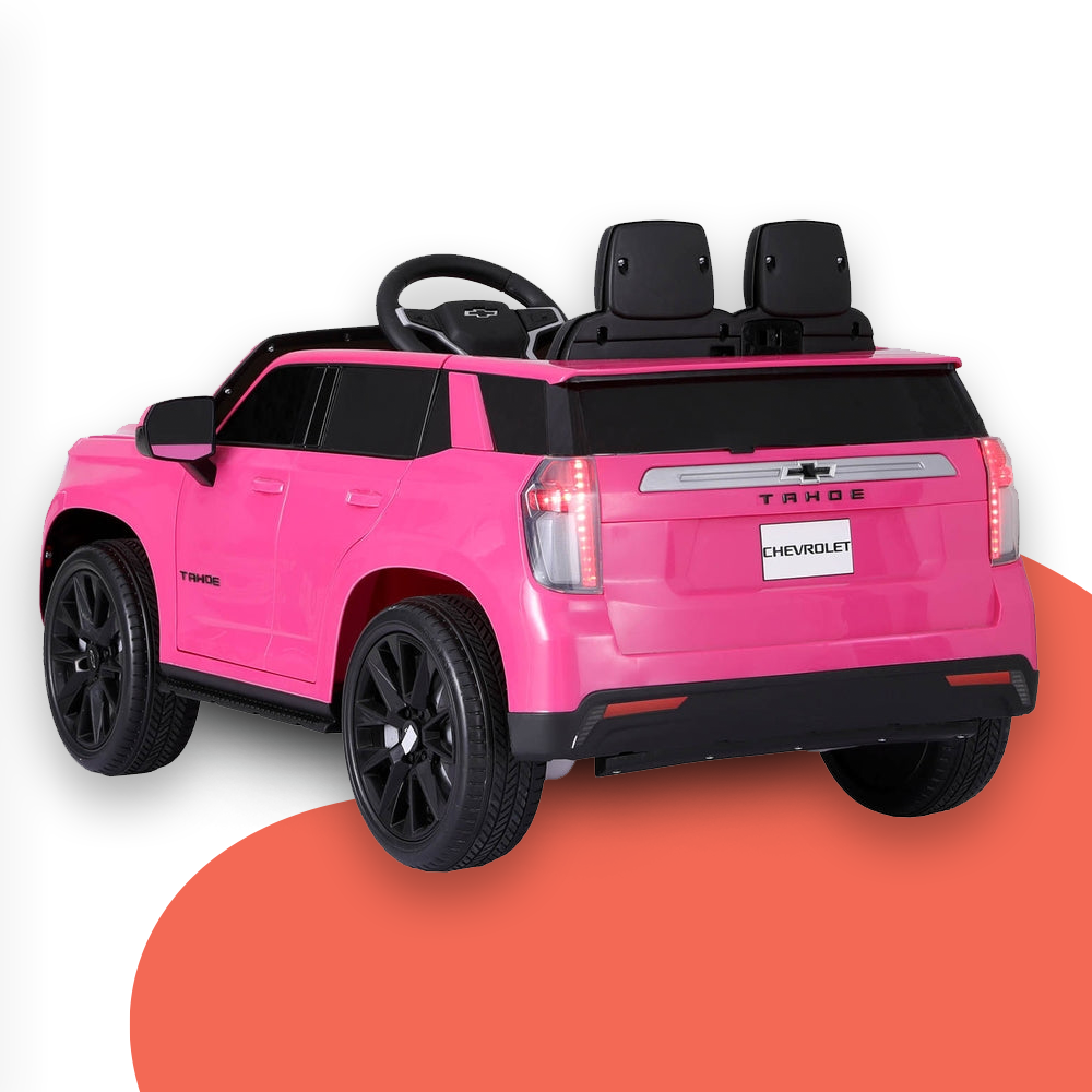 Rear view of the pink Chevrolet Tahoe-inspired ride-on electric car, featuring detailed tail lights and a "Chevrolet Tahoe" logo, with a red accent background.