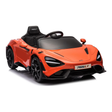An orange and black toy ride-on car styled like a McLaren 765LT, featuring a black interior, steering wheel, and wheels, shown on a white background.