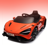 An orange and black toy sports car modeled after a McLaren 765LT, shown from a three-quarters front angle on a white background with a pink gradient sky.