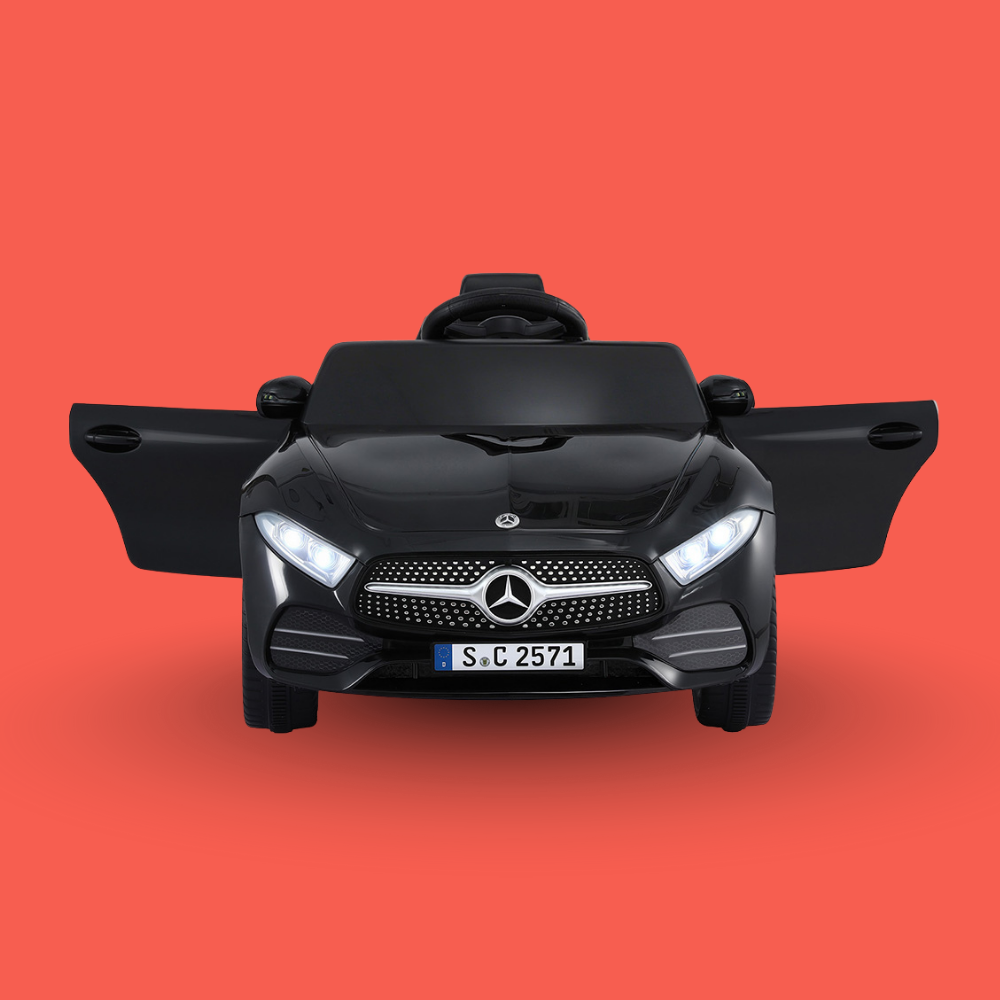 Black toy car with Mercedes-Benz logo on a red background