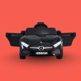 Black toy car with Mercedes-Benz logo on a red background