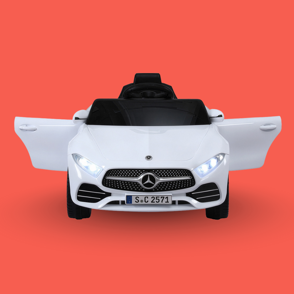 White toy car with Mercedes-Benz logo on an orange background