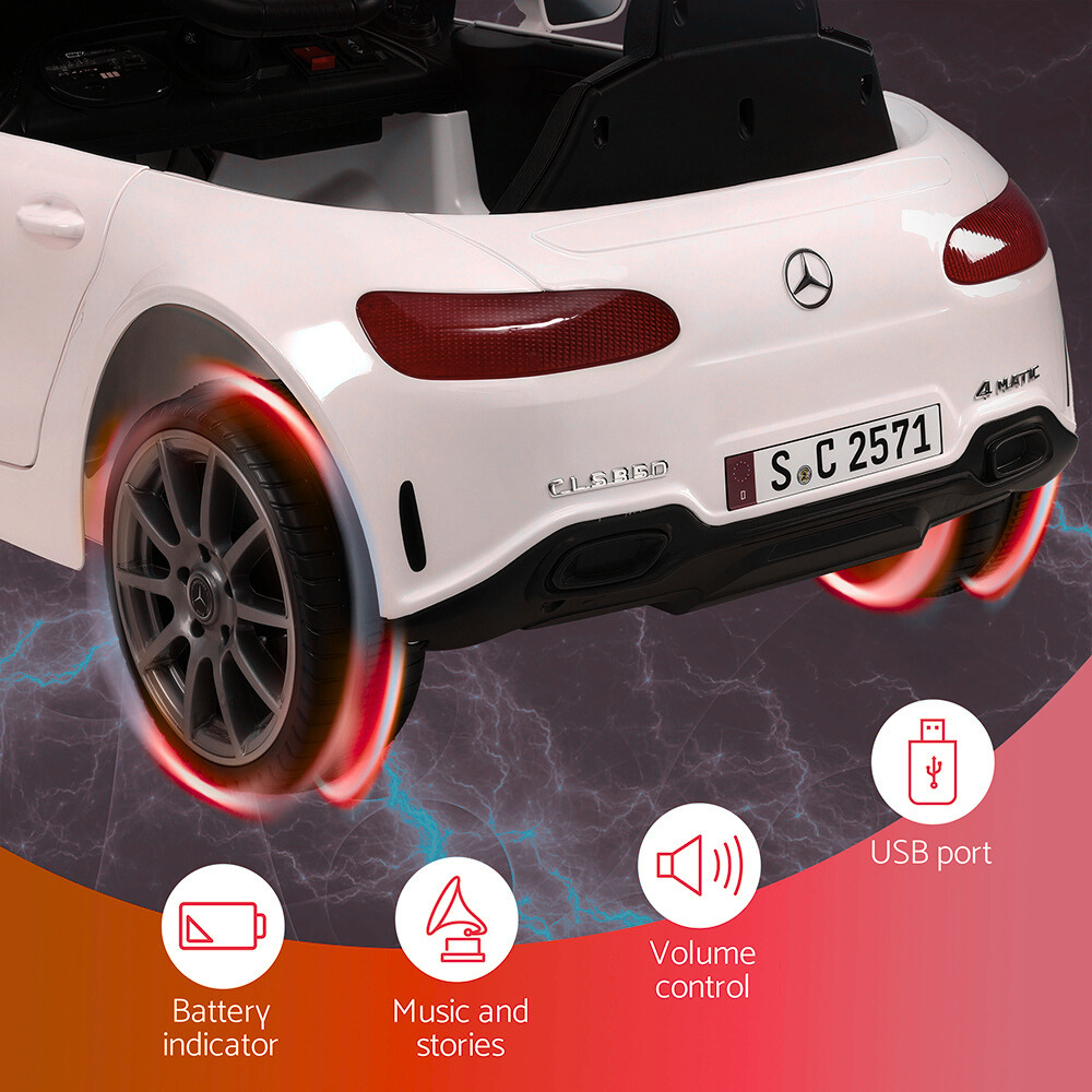 White toy car with Mercedes-Benz logo on a dark background