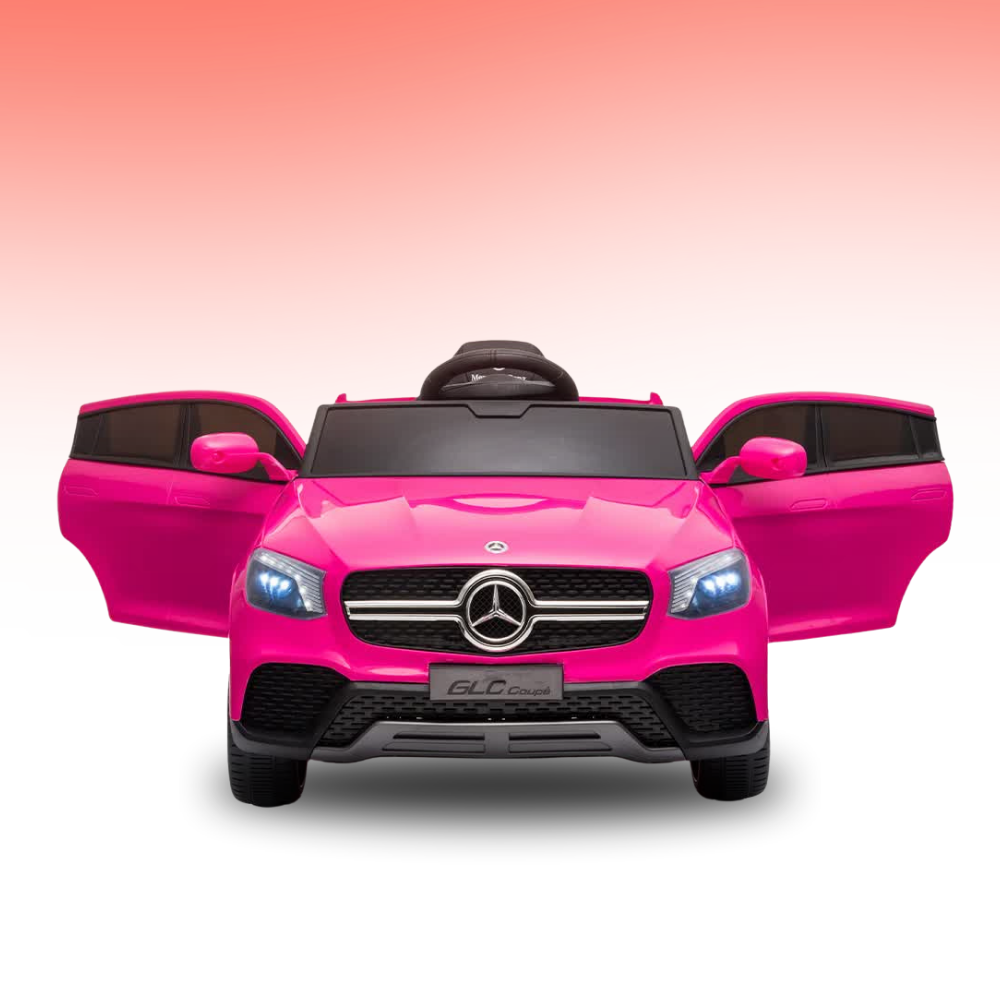 A bright pink Mercedes-Benz GLC-style ride-on toy car with open doors, shown from the front on a white background with a soft pink-to-white gradient.