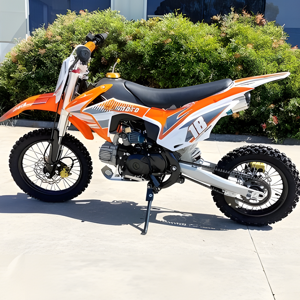 side view of MJM 110cc Petrol Powered 4-Stroke Kids Trail Pit Dirt Bike - Orange